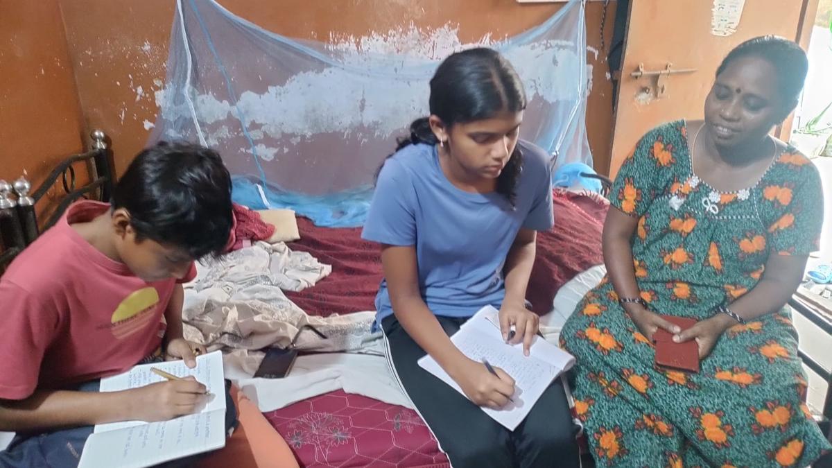 Two students study the Perumbakkam
lake to assess its ecological health