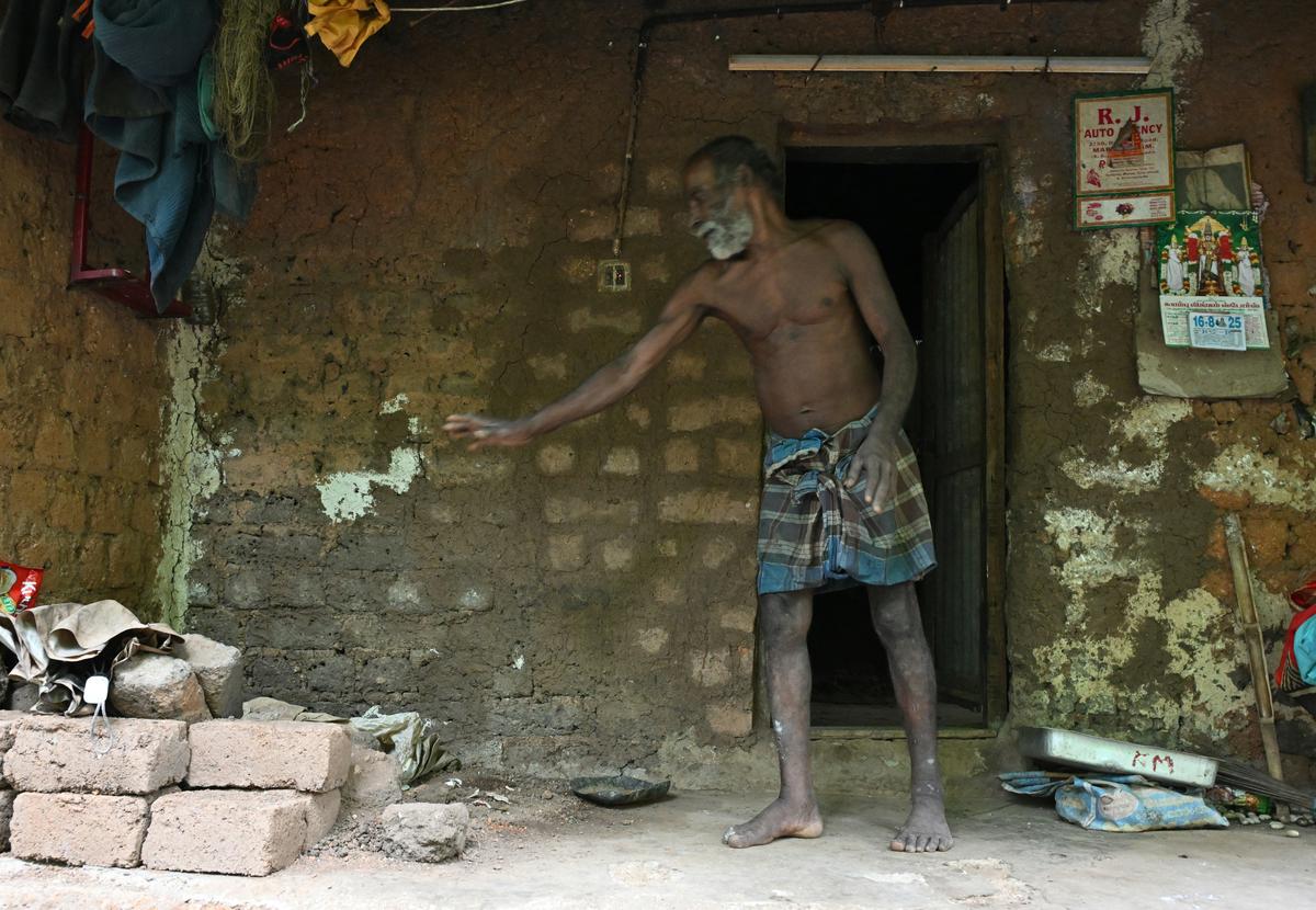 A tribal shows the damage caused to his house during an elephant attack in Kanniyakumari district.