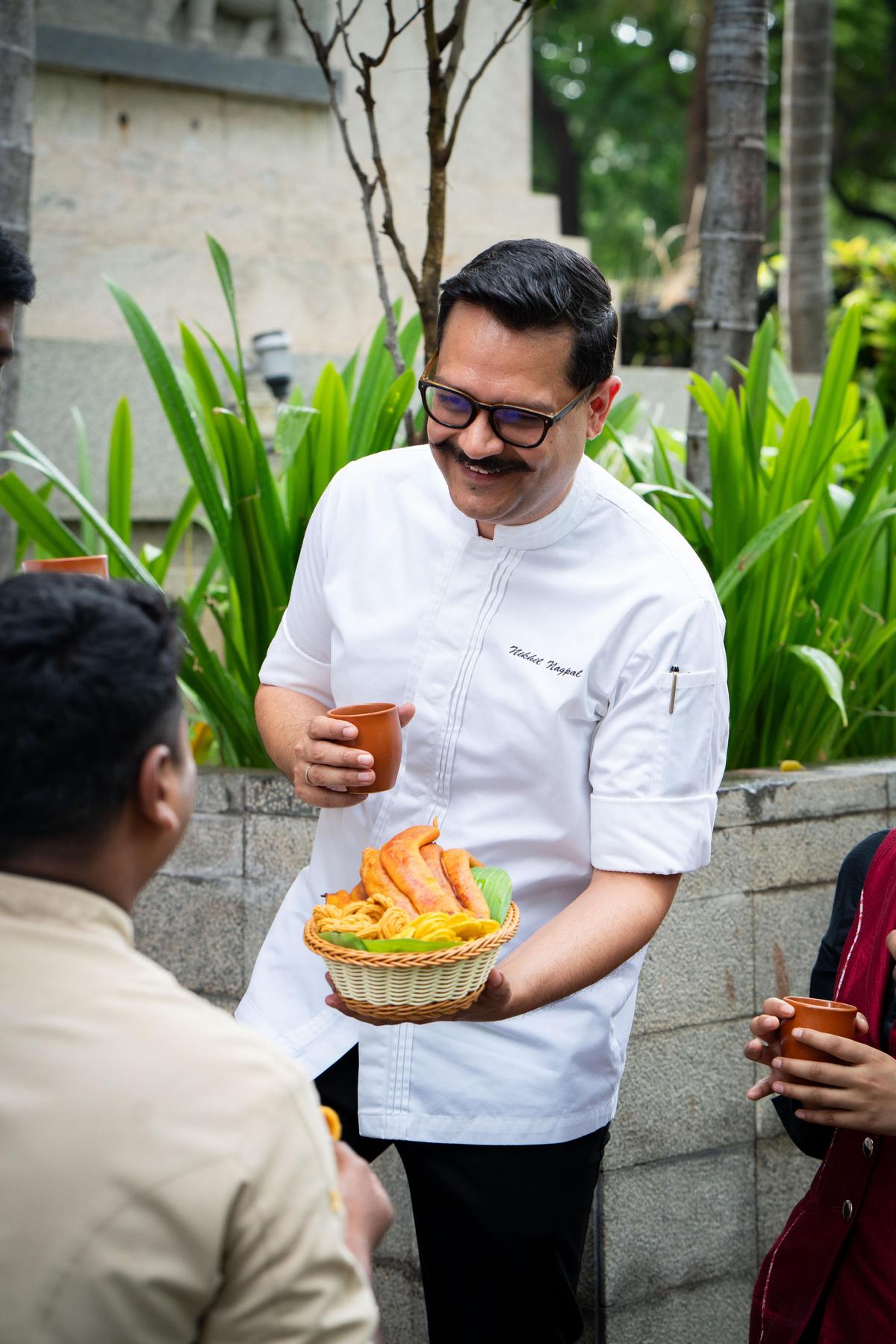Chef Nikhil Nagpal indulging in fresh hot pazham pori 