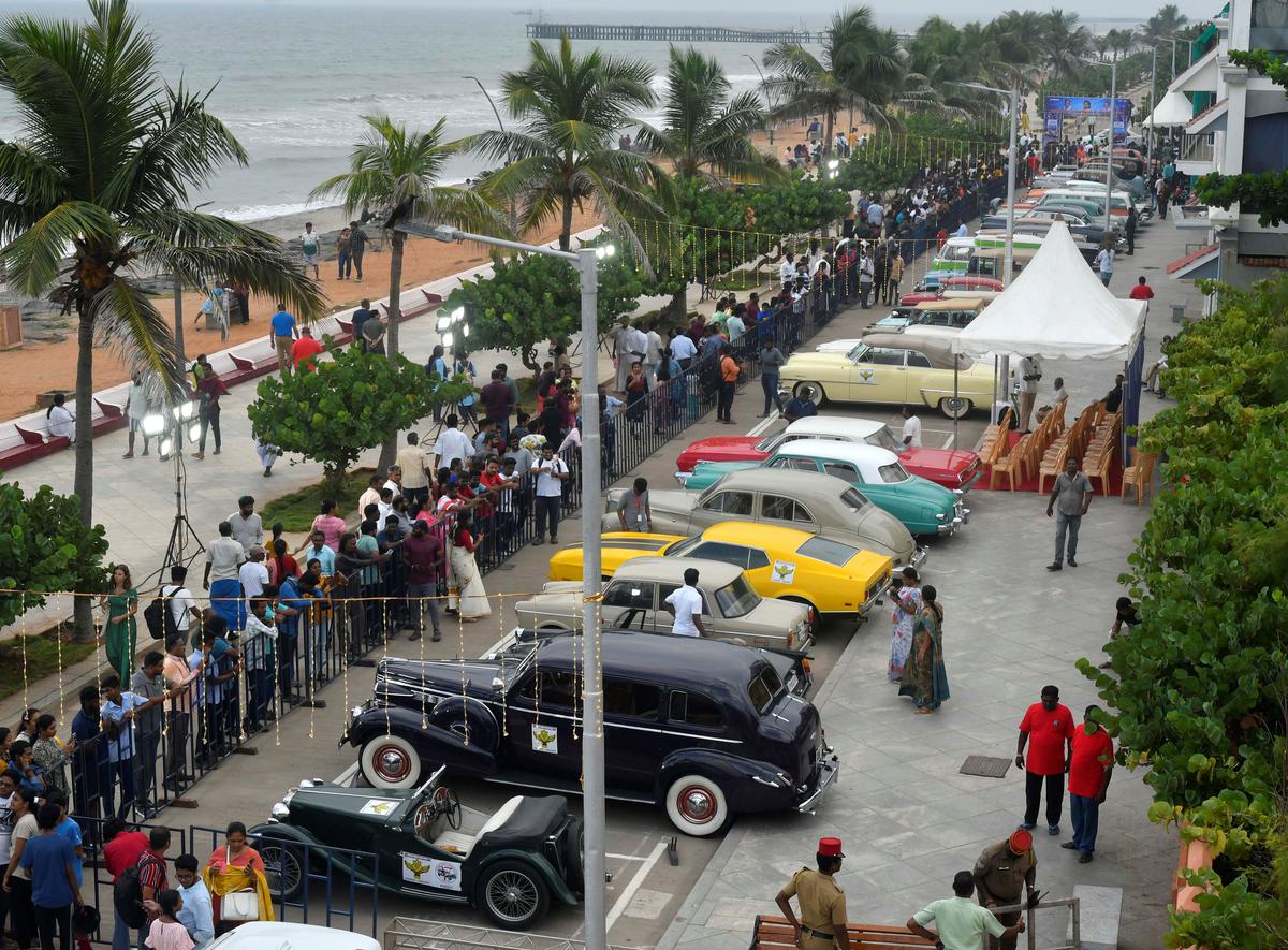 Visitors taking a look at the Heritage Cars display, organised by Historical Cars Association of India on Beach Road in Puducherry on Monday.