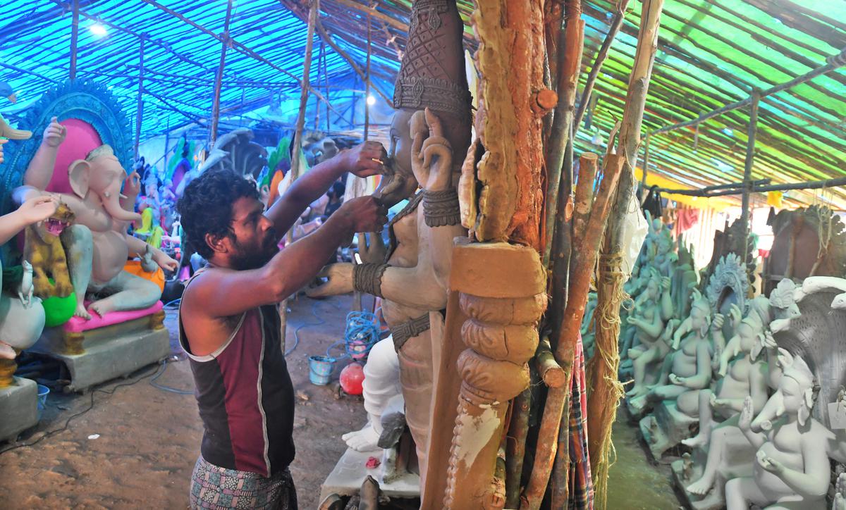 Idol makers from West Bengal make Ganesha idols from clay brought from the banks of the Ganges near Lawson's Bay in Visakhapatnam 