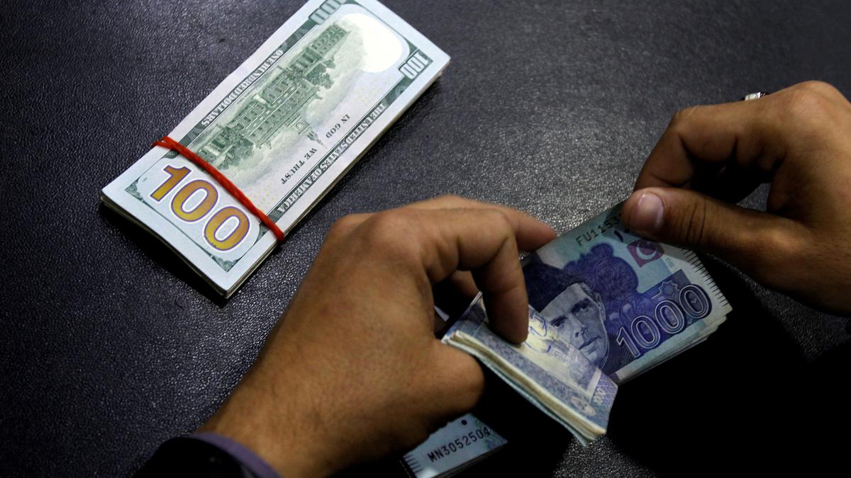 Cash-strapped Pakistan's rupee plunges amid talks with IMF