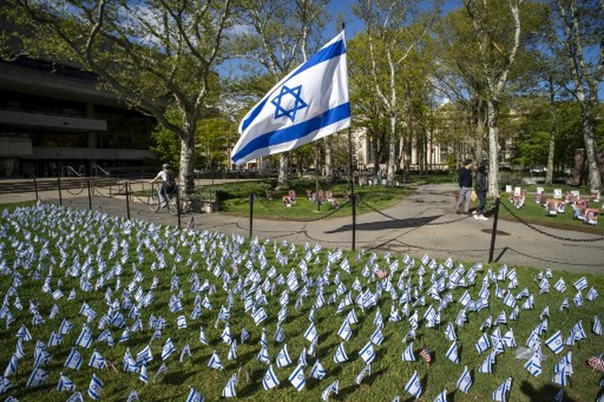 Israeli flags are pictured in front of a pro-Palestinian encampment (out of frame) on the lawn of the Stratton Student Center campus at the Massachusetts Institute of Technology (MIT) in Cambridge, Massachusetts, on May 9, 2024. 