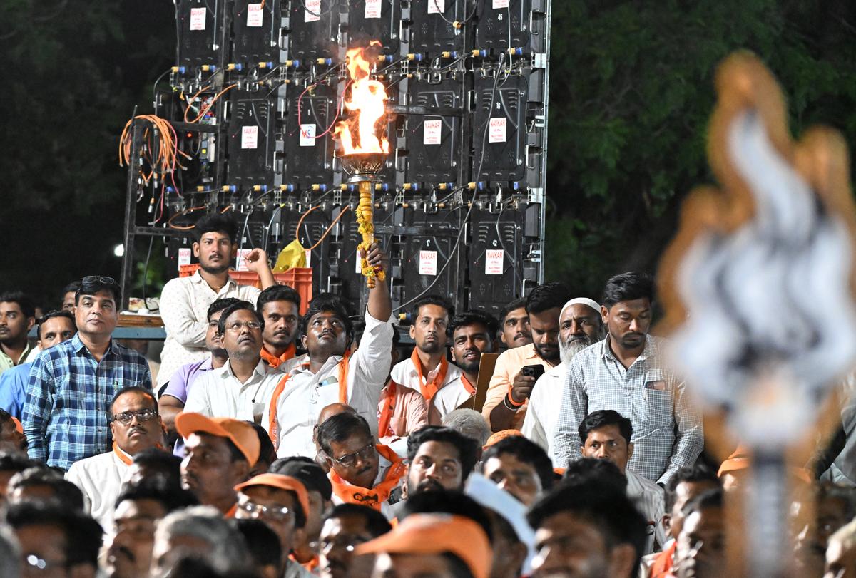 Shiv Sena (UBT) party cadres holds handed the “mashal” (flaming torch) symbol. 