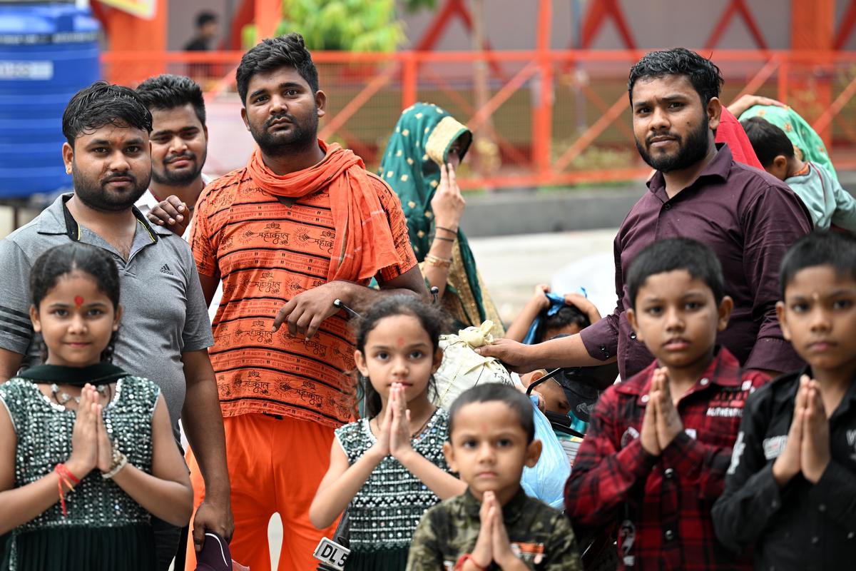 A kanwariya posing for a photo with his family in Delhi.