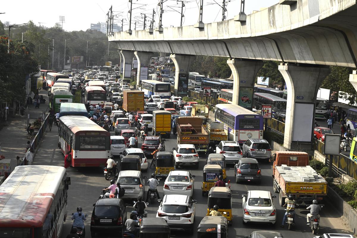 Commuters through a massive traffic jam at Uppal X Road in Hyderabad.