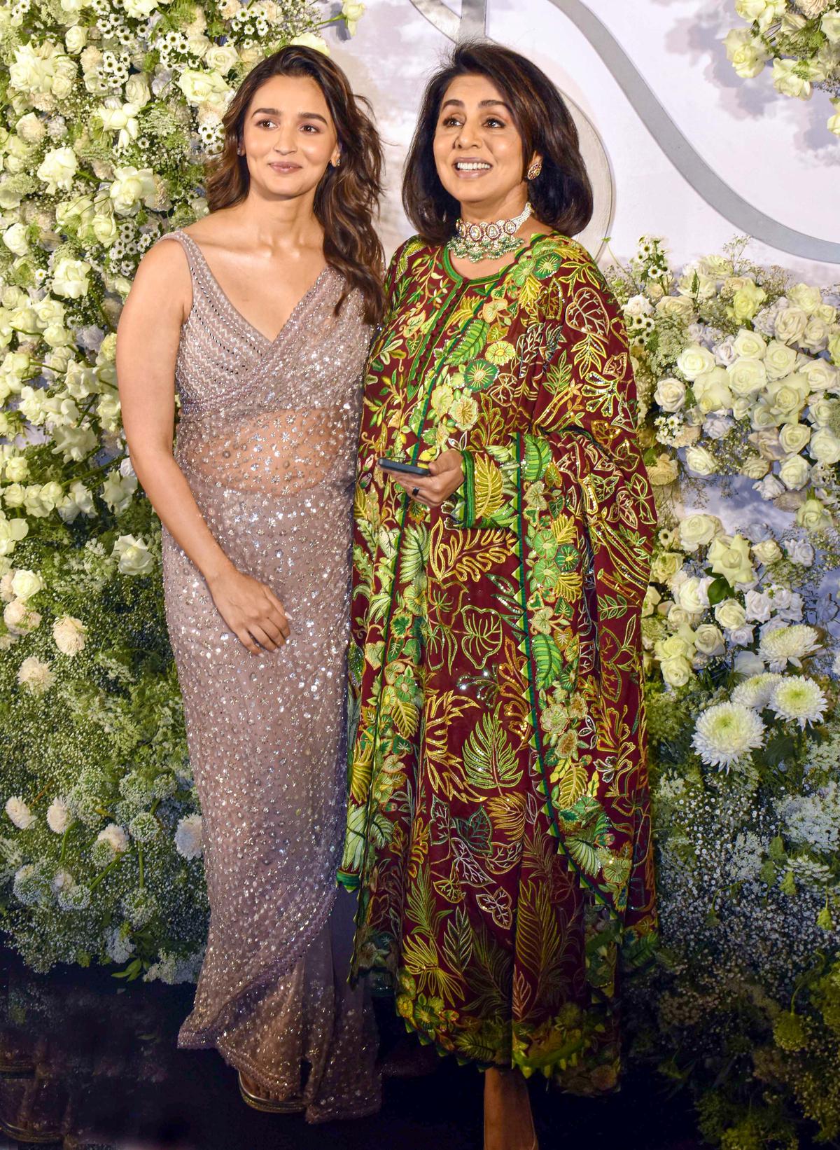 Alia Bhatt and Neetu Kapoor posed for pictures at the wedding reception