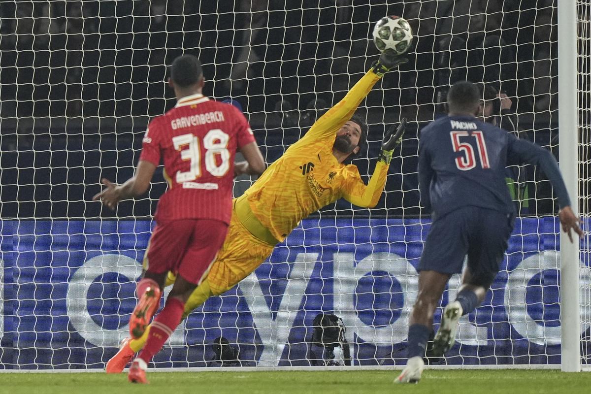 Liverpool’s goalkeeper Alisson makes a save during the Champions League match against Paris Saint-Germain