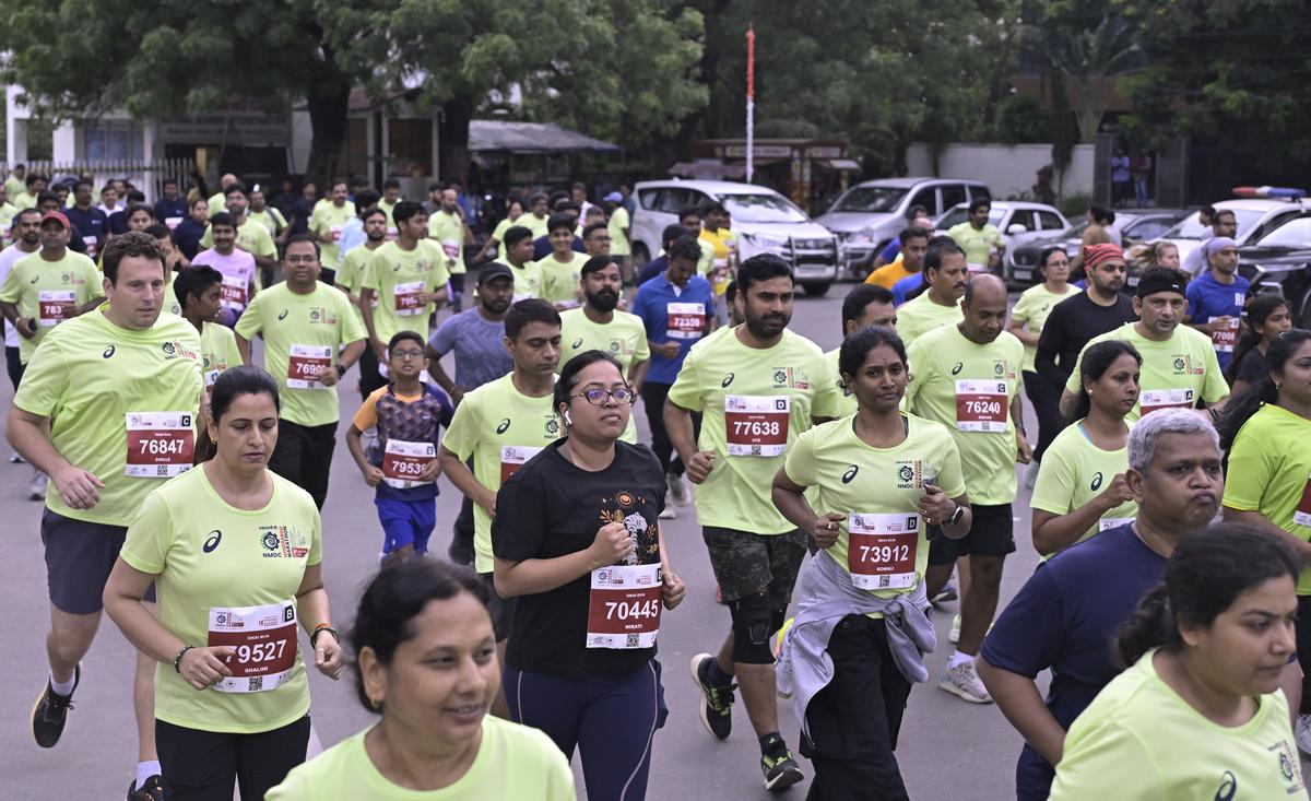 Runners in action during the 14th edition of the NMDC Hyderabad Marathon in Hyderabad on Saturday.