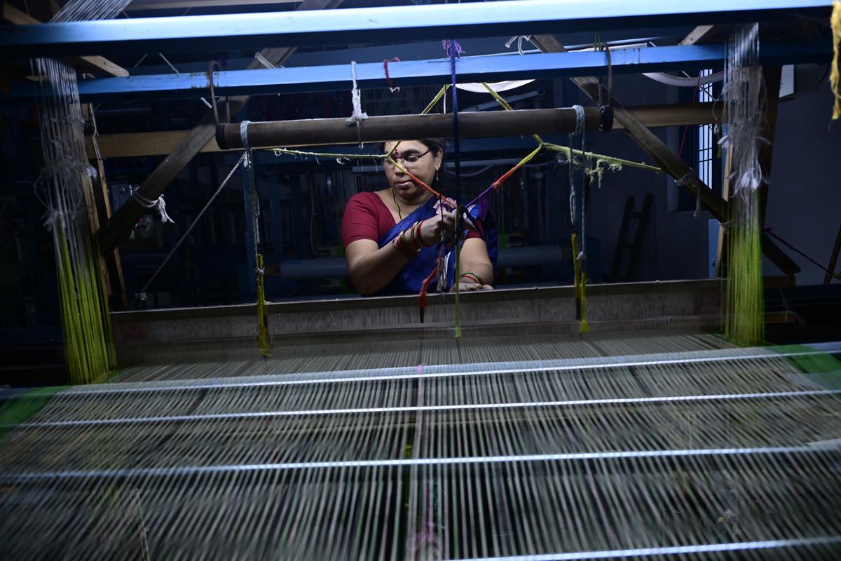 A woman weaver working on a traditional loom at a home in Mangalagiri of Guntur district. 