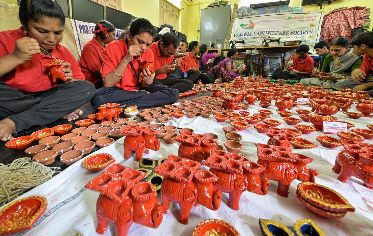 Differently abled members of Prajwal Vani Welfare Society, painting deepams ahead of Deepavali in Visakhapatnam.