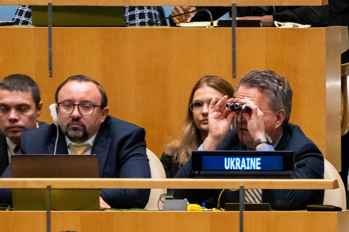 Ukrainian Ambassador to the U. N. Sergiy Kyslytsya scans the general assembly with binoculars prior to the vote