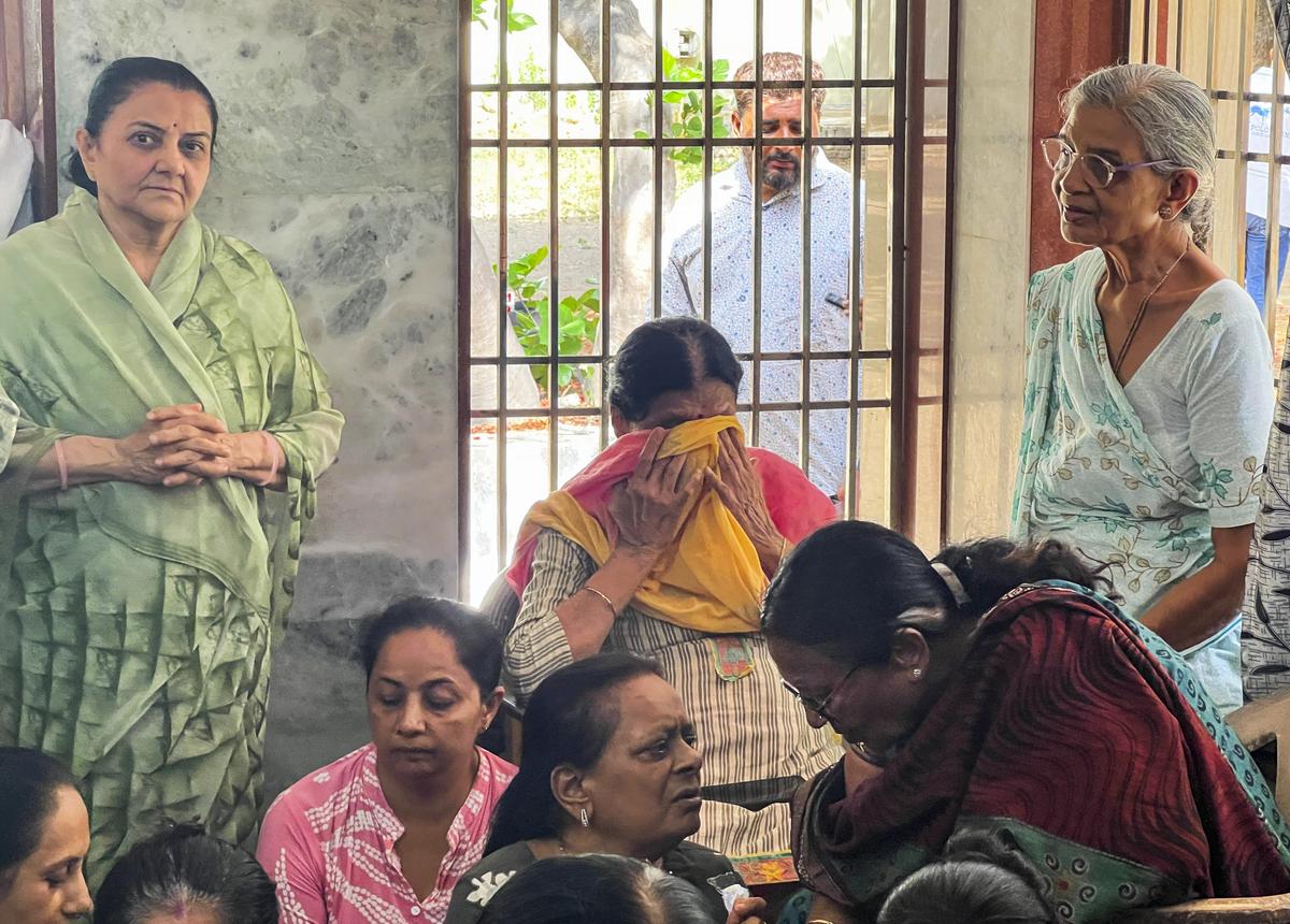 Relatives mourn at the residence of former Gujarat Chief Minister Vijay Rupani in Rajkot, Thursday, June 12, 2025. Rupani was among the passengers onboard the Air India flight that crashed in Ahmedabad. = Relatives mourn at the residence of former Gujarat Chief Minister Vijay Rupani in Rajkot, Thursday, June 12, 2025. Rupani was among the passengers onboard the Air India flight that crashed in Ahmedabad. =