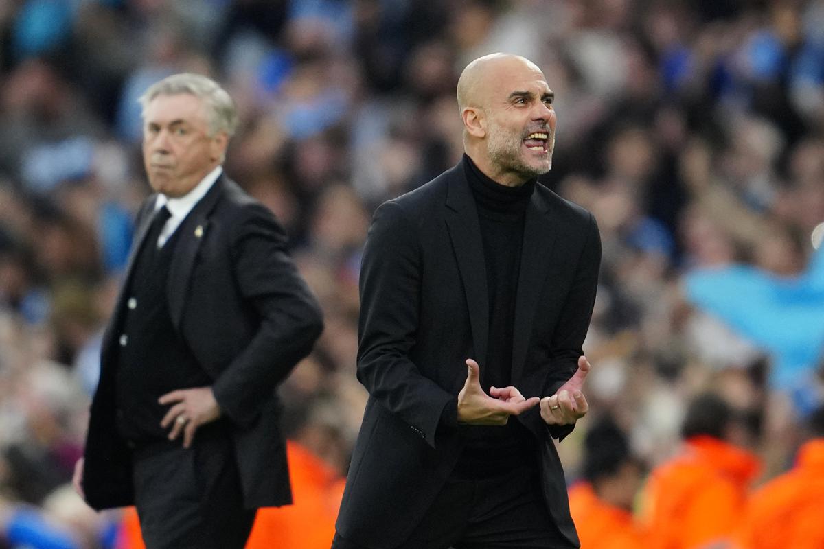 Manchester City’s head coach Pep Guardiola reacts after Bernardo Silva scored the opening goal during the Champions League semifinal second leg soccer match between Manchester City and Real Madrid at Etihad stadium in Manchester, England, Wednesday, May 17, 2023. 