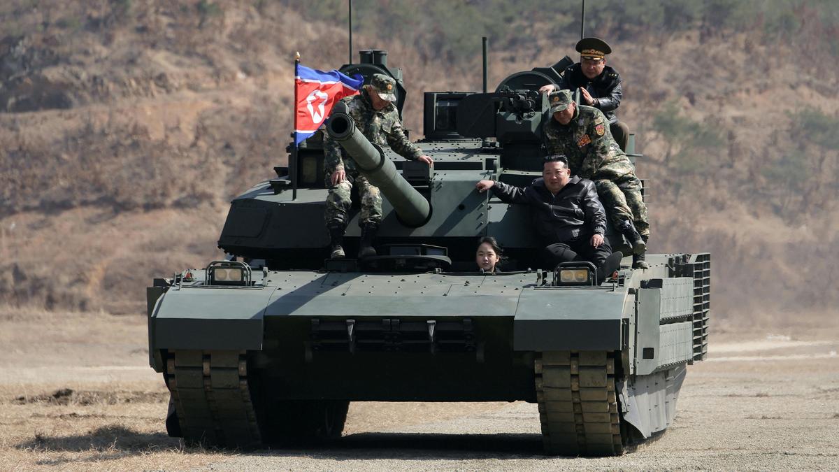 North Korea’s Kim takes his daughter on tank ride during army training