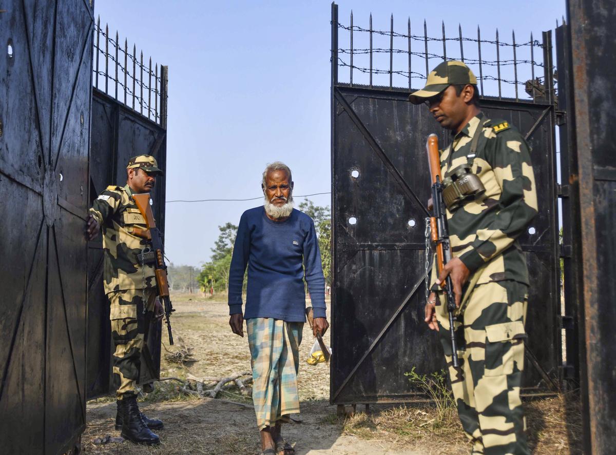 Border Security Force (BSF) personnel stand guard at the Dharmanagar area in North Tripura district on Friday, January 24, 2025. 