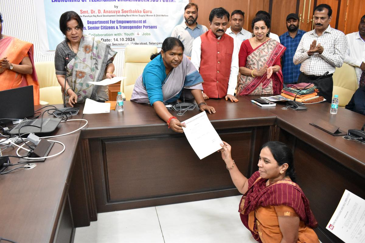 Minister of Women and Child Welfare, Danasari Anasuya (Seethakka) handing over an appointment letter to a person with disability at the Telangana Secretariat on Monday (October 14, 2024). Secretary of the Women and Child Welfare Department, Vakati Karuna; chairperson of Disabled Coperative Corporation Veeraiah, and Joint Director of Disabled and Elderly Welfare, Shailaja, were present at the event.