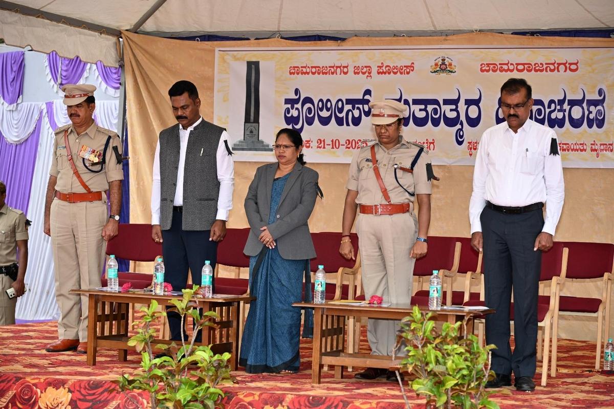 Principal District and Sessions Judge G. Prabhavathi, Chamarajanagar Superintendent of Police B.T. Kavitha, and other dignitaries observing the Police Martyrs’ Day in Chamarajanagar on Tuesday.