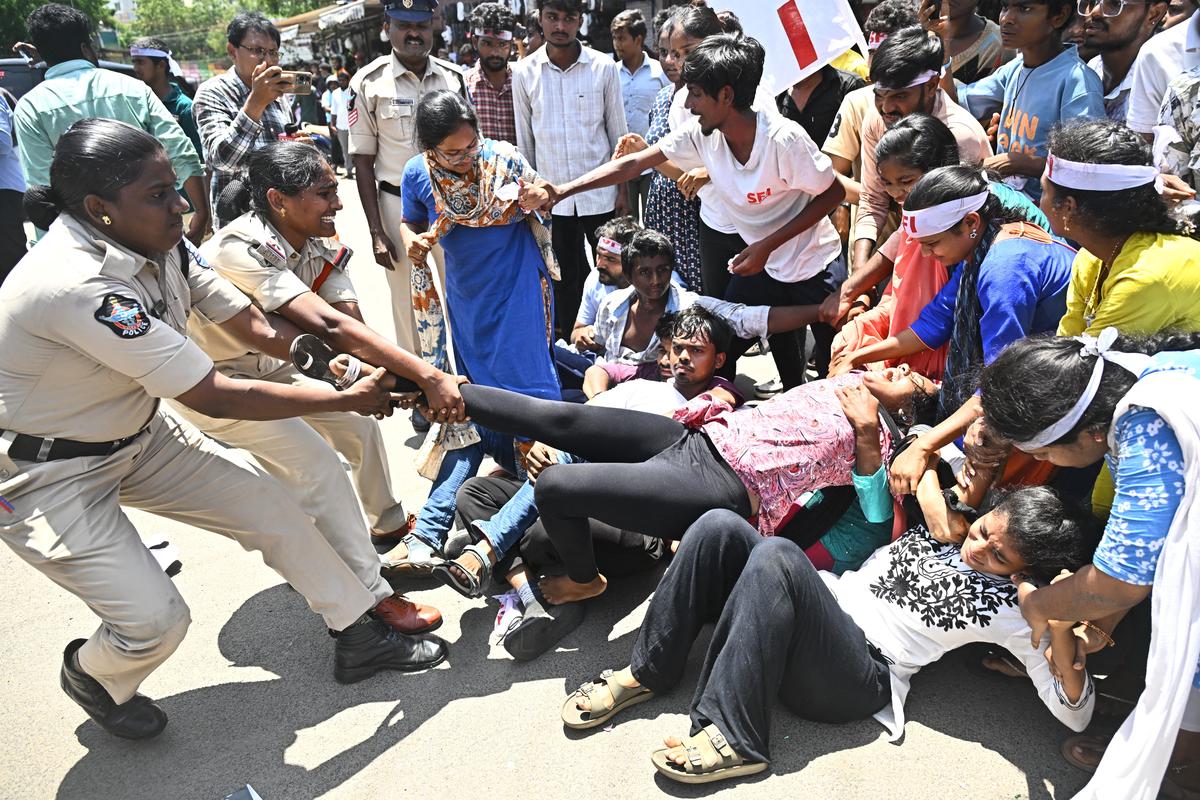 Police removing the SFI activists from Dharna Chowk in Vijayawada on Saturday.