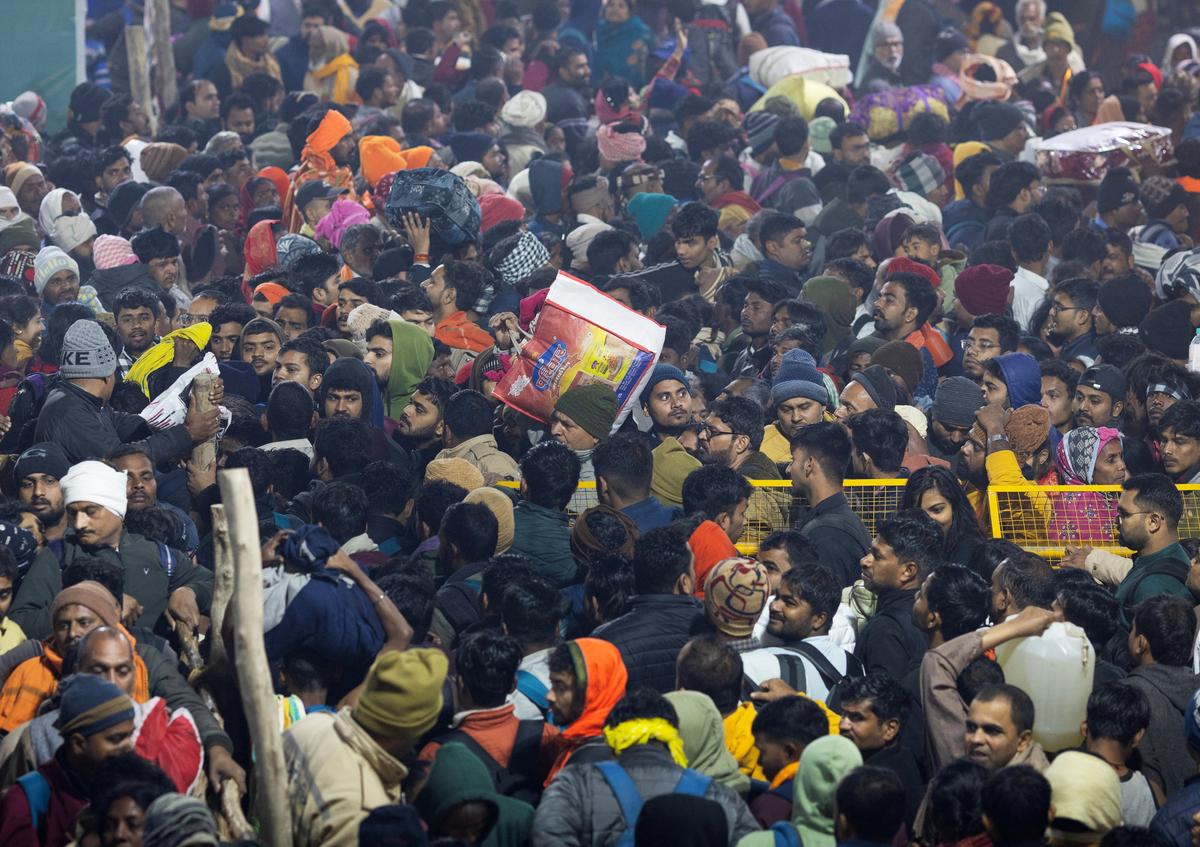 Devotees try to leave the area during the “Shahi Snan” (royal bath), at the “Maha Kumbh Mela” or the Great Pitcher Festival in Prayagraj on Wednesday, January 29, 2025.