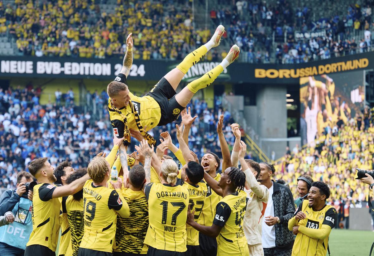 Dortmund’s Marcus Reus is thrown into the air after Borussia Dortmund’s match against SV Darmstadt 98 at the Signal Iduna Park in Dortmund.