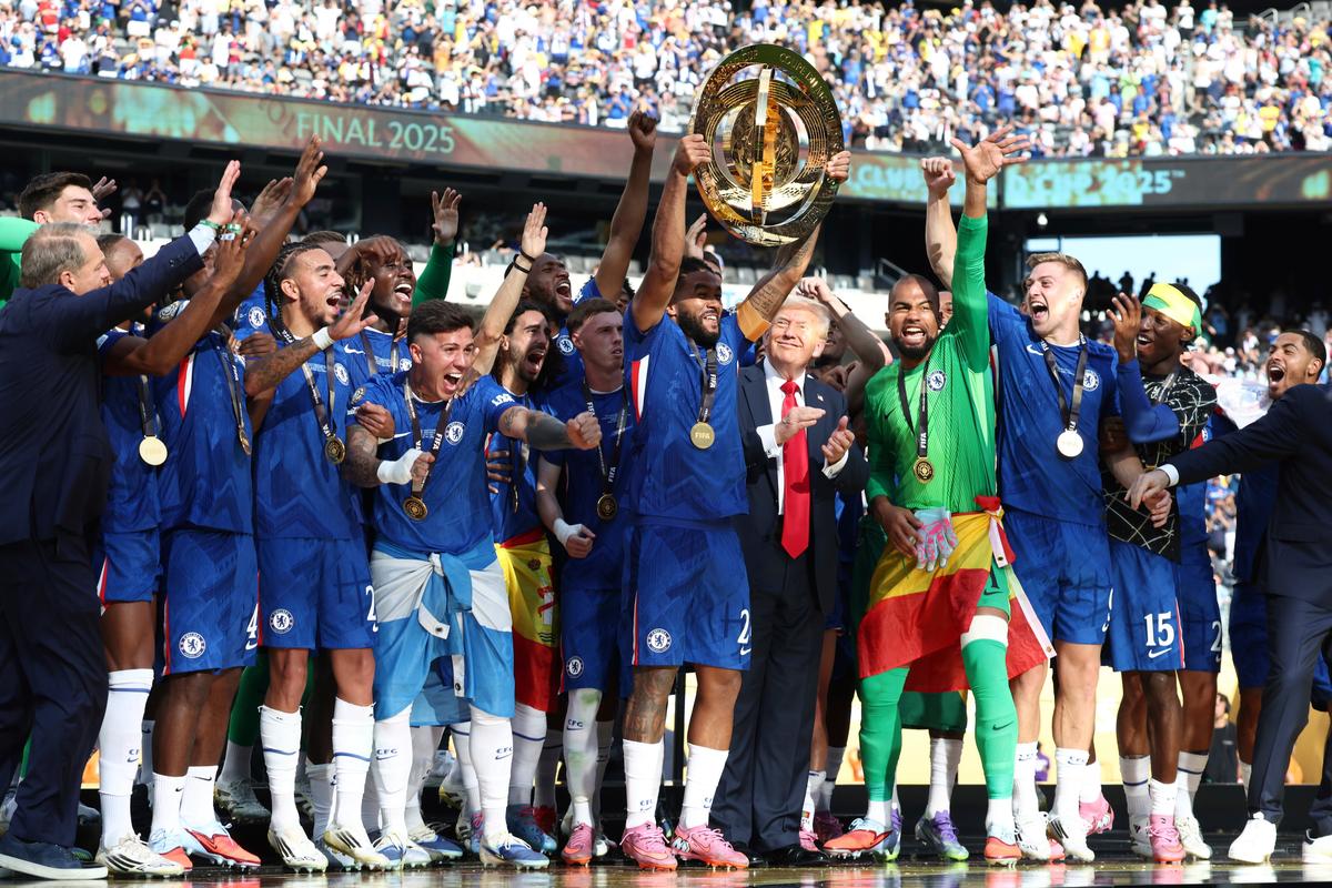 Chelsea’s Reece James lifts the trophy as he celebrates with teammates and President Donald Trump, fifth from right, after Chelsea won against Paris St Germain in the Club World Cup final, at MetLife Stadium in East Rutherford, on July 13, 2025 Chelsea’s Reece James lifts the trophy as he celebrates with teammates and President Donald Trump, fifth from right, after Chelsea won against Paris St Germain in the Club World Cup final, at MetLife Stadium in East Rutherford, on July 13, 2025