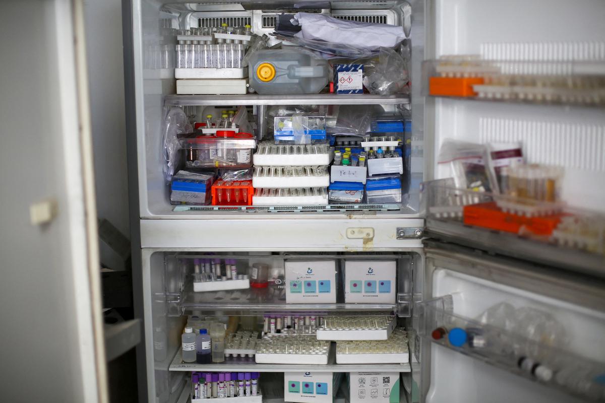 Tubes of specimens are seen in a broken fridge inside Al Basma IVF Centre, Gaza’s largest fertility clinic which was struck by an Israeli shell during the ongoing conflict between Israel and the Palestinian Islamist group Hamas, in Gaza City, April 2, 2024.  