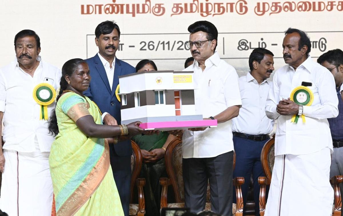 Tamil Nadu Chief Minister M.K. Stalin distributing welfare assistance to a beneficiary at a function held at Solar in Erode district on November 26, 2025
