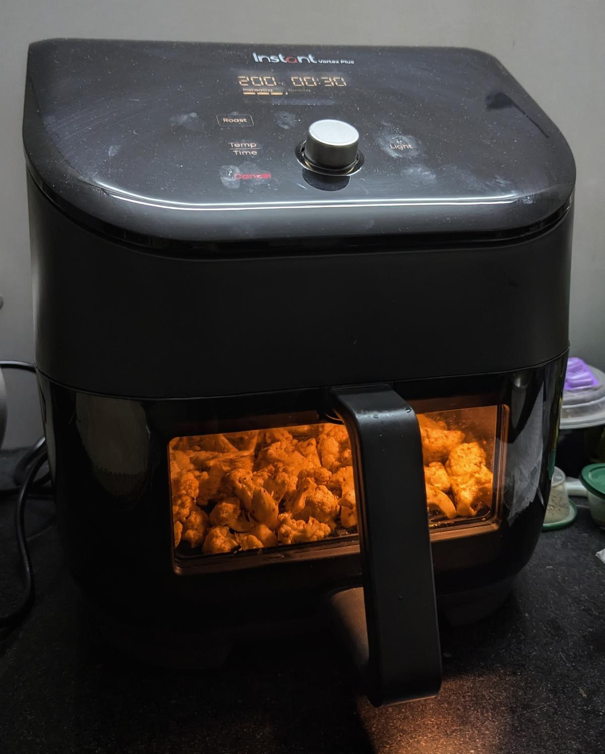 Cauliflower roasting in an airfryer