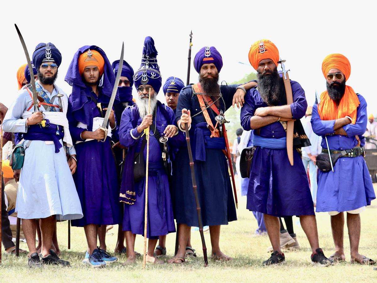 Nihang Singhs in indigo dyed clothing at Sri Anandpur Sahib - Hola Mohalla Festival in Punjab