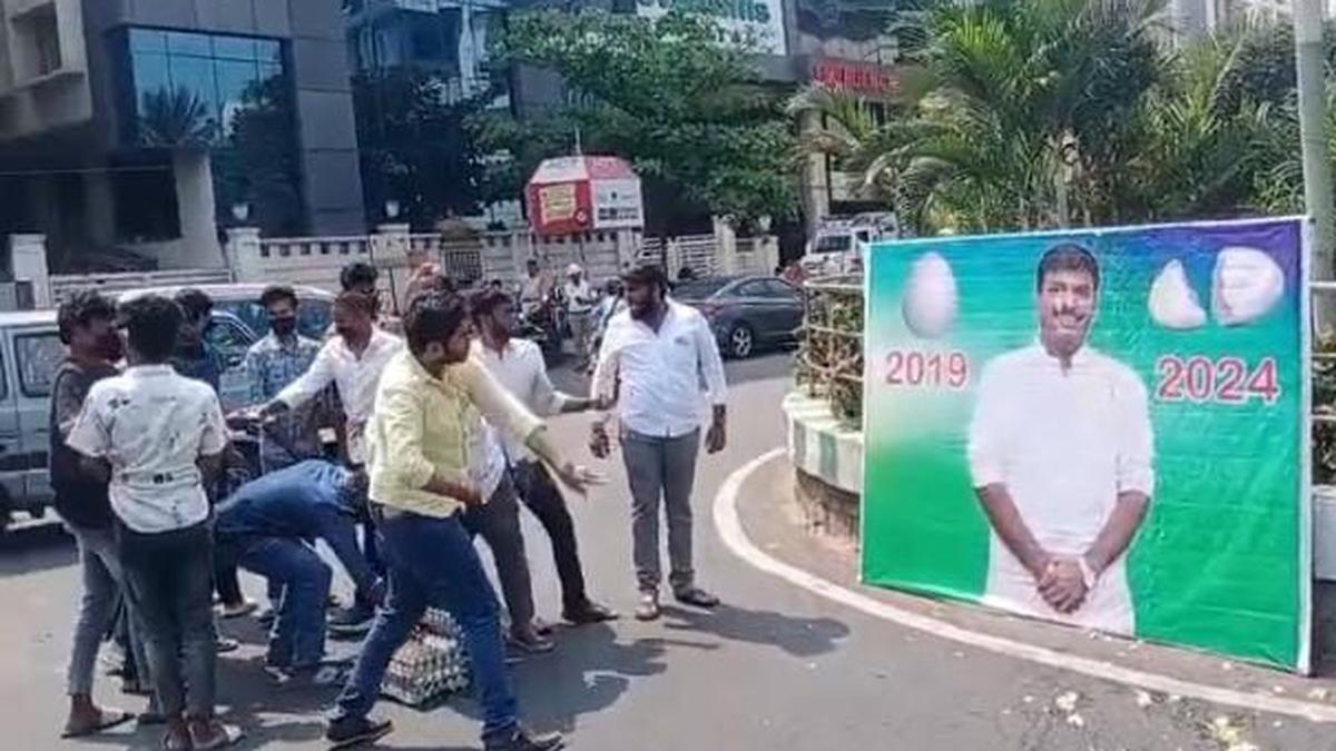 Telugu Desam student wing activists hurl eggs at IT Minister Gudivada Amarnath’s flexi
