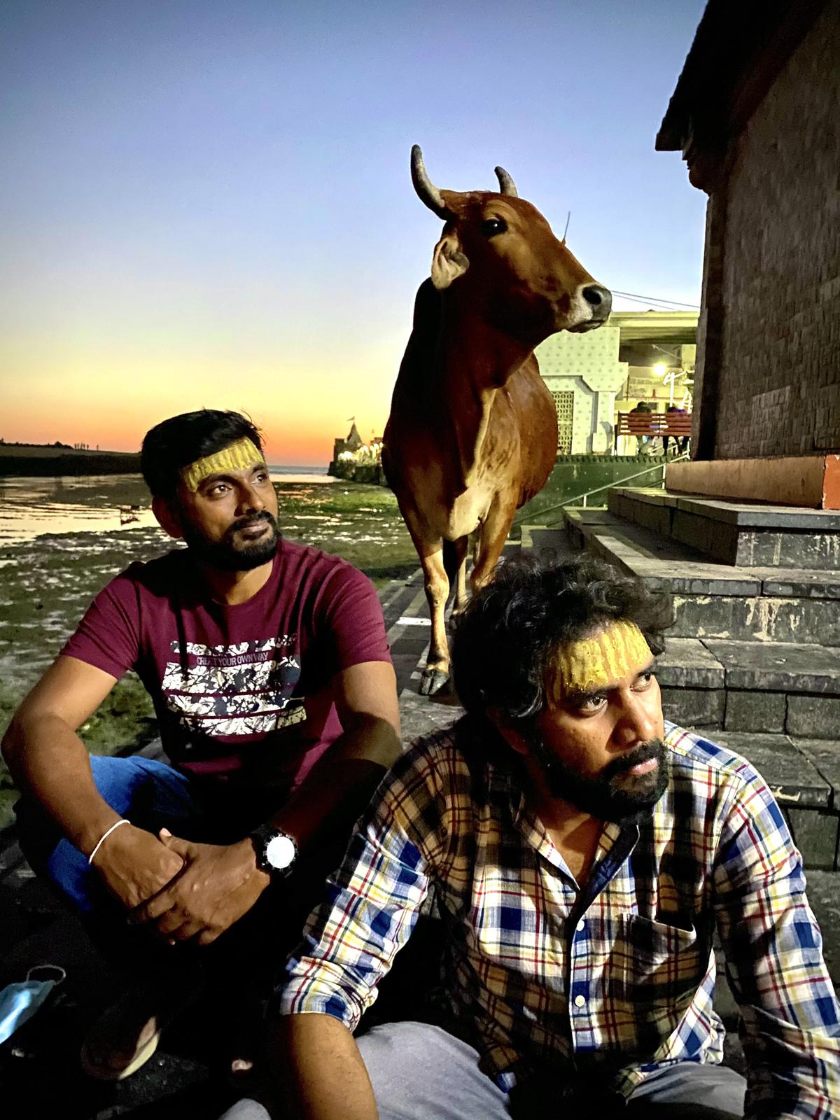 Sahi Suresh (in red) and Chandoo Mondeti on the sets of ‘Karthikeya 2’