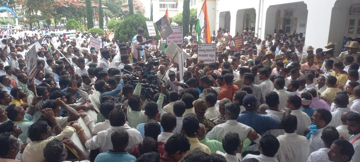 In Hassan, Congress supporters took part in a protest march on B.M. Road, on August 19, 2024.  