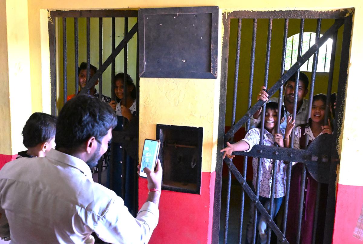 Visitors taking pictures of a ‘police station’ set created at Rama Naidu studio on Beach Road in Visakhapatnam. 