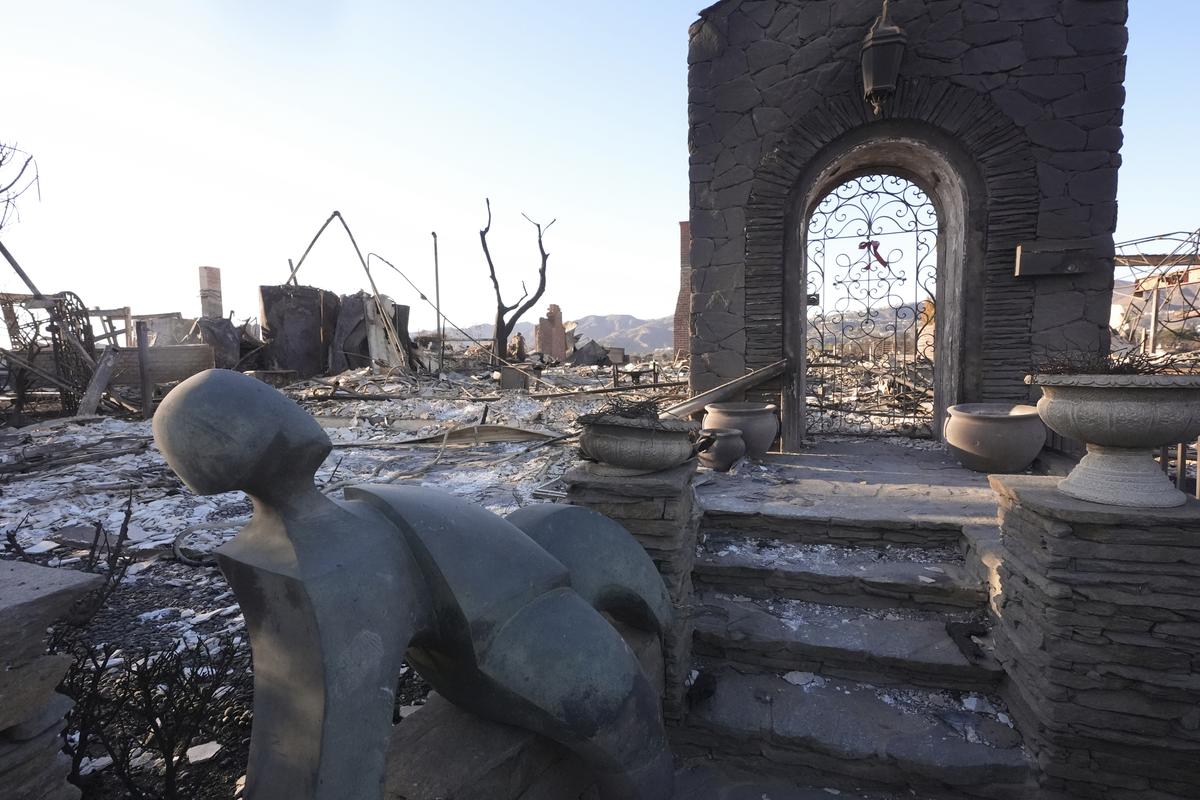 A statue sits outside a home destroyed by the Palisades Fire in the Pacific Palisades neighbourhood of Los Angeles, Sunday, Jan. 12, 2025. 