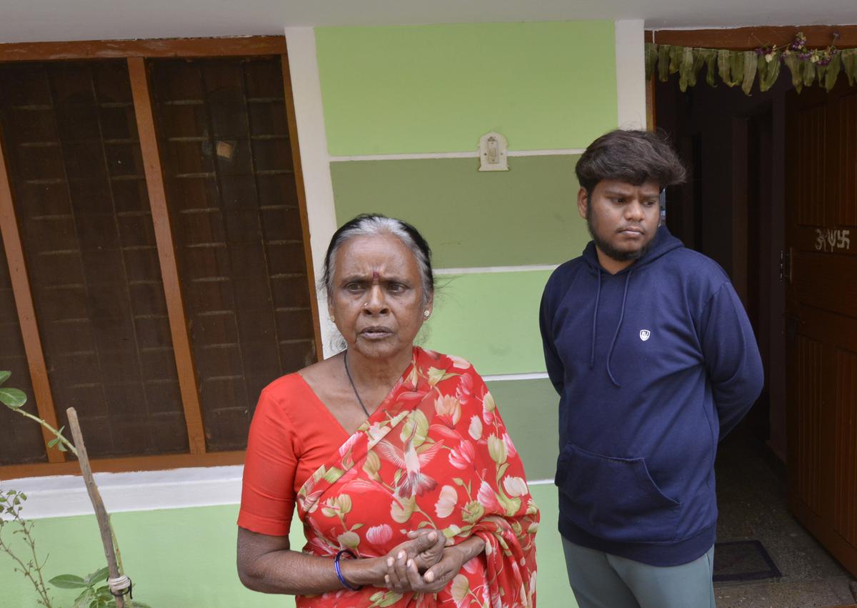Hemanth M. with his aunt Rangamma in front of their house in Kolar city.