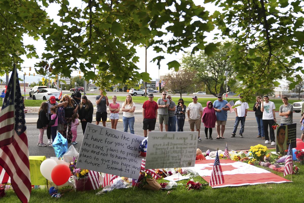 Supporters gather at a makeshift memorial in Orem, at Utah Valley University for Turning Point USA CEO and co-founder Charlie Kirk who was fatally shot during an event on the campus, on September 13, 2025.