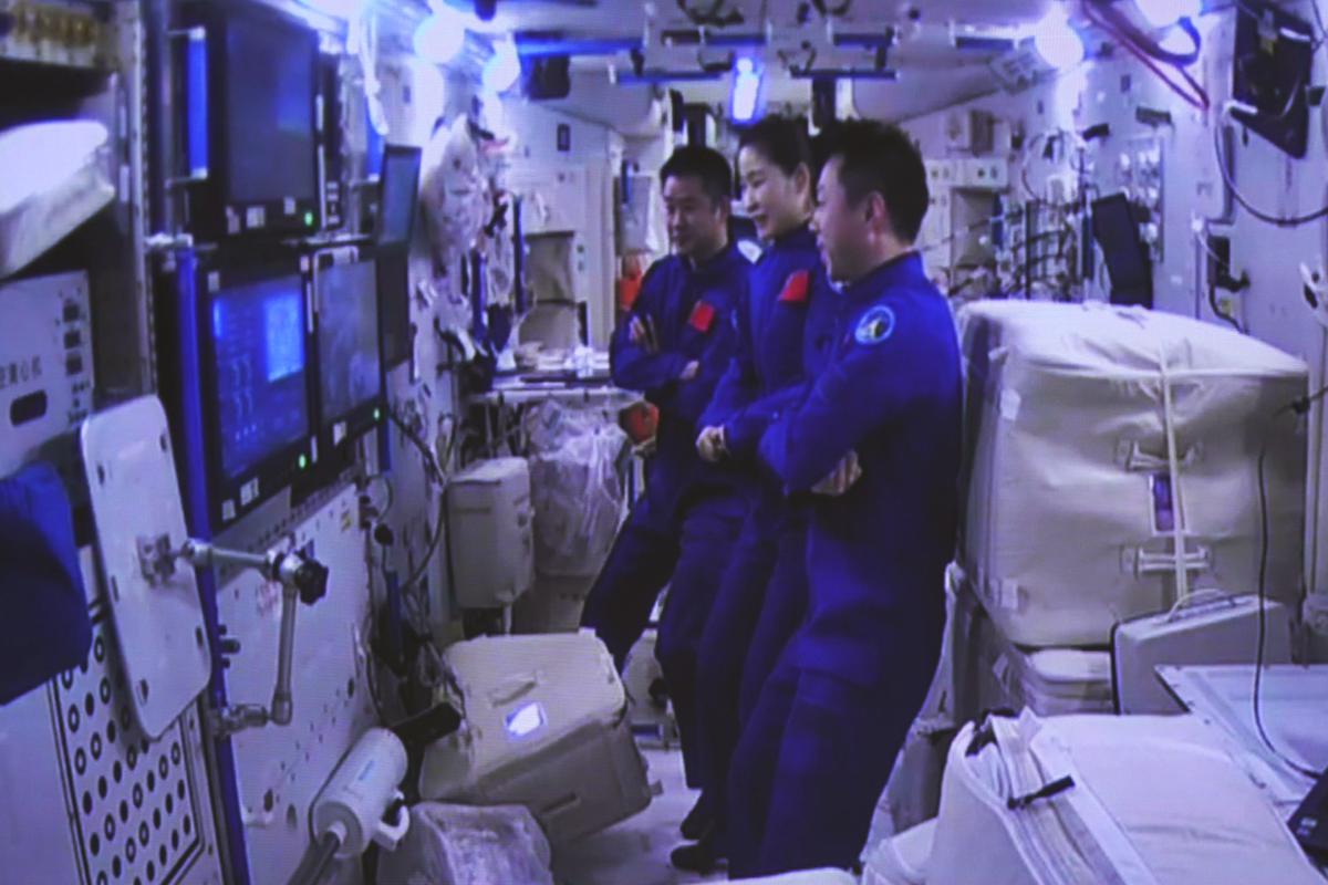 Chinese spaceship with 3 aboard docks with space station