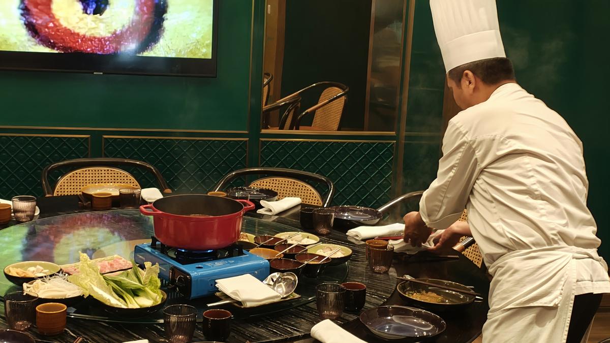 Chef Cong Yong Li preparing a hot pot lunch