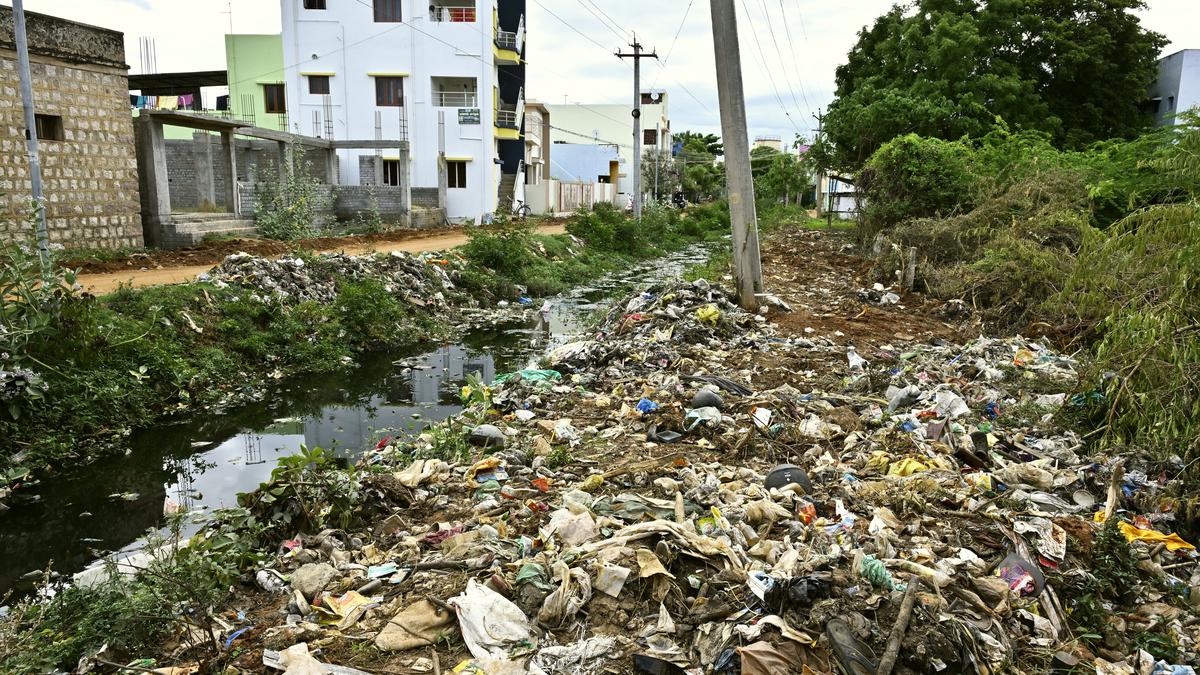 Water channel in Othakadai flush with household waste