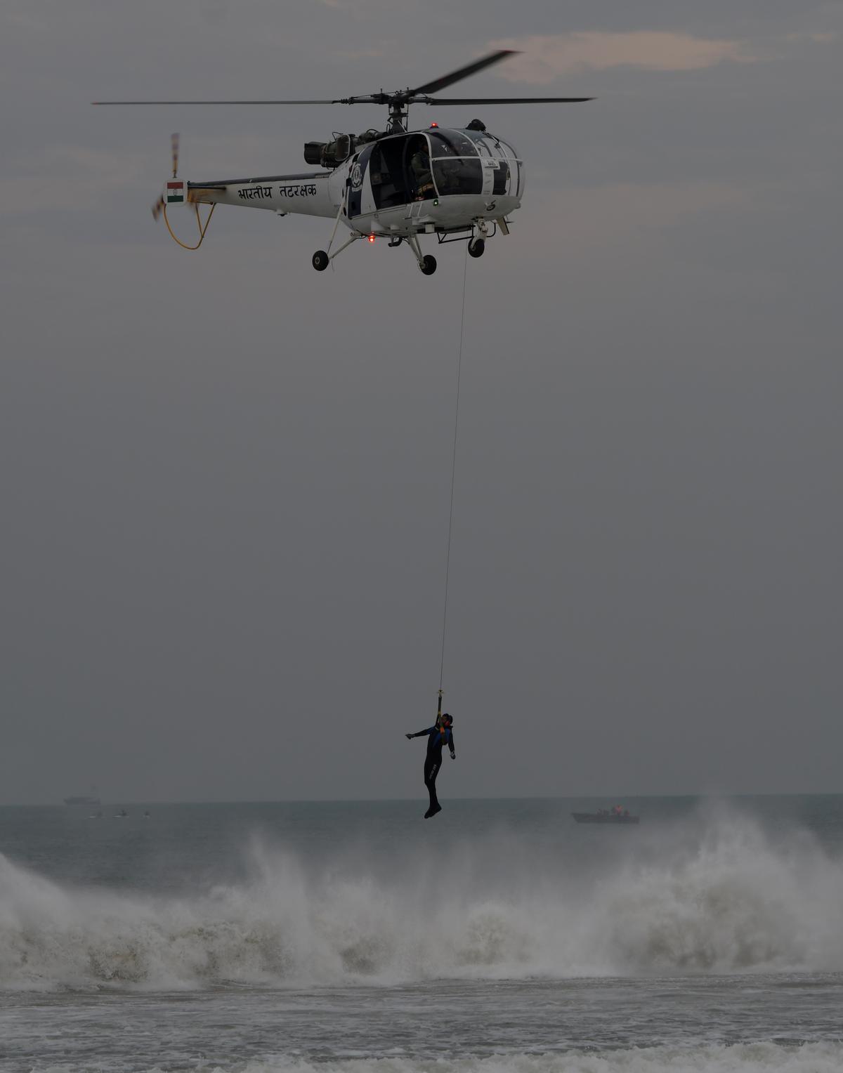 Coast Guard performing rescue operation at Marina Beach in Chennai on Saturday. 