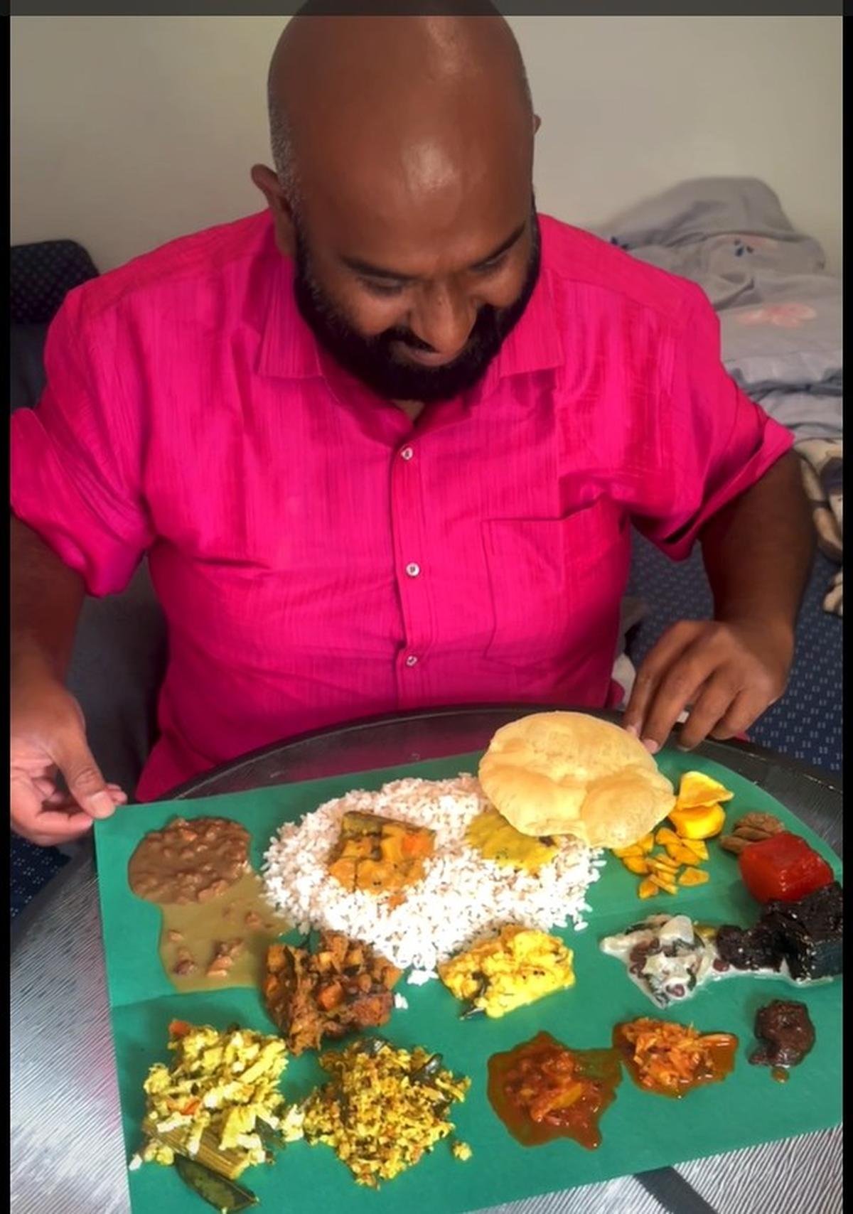 Toronto-based Malayali food blogger Nishin MG with the ready-to-eat sadya spread Toronto-based Malayali food blogger Nishin MG with the ready-to-eat sadya spread