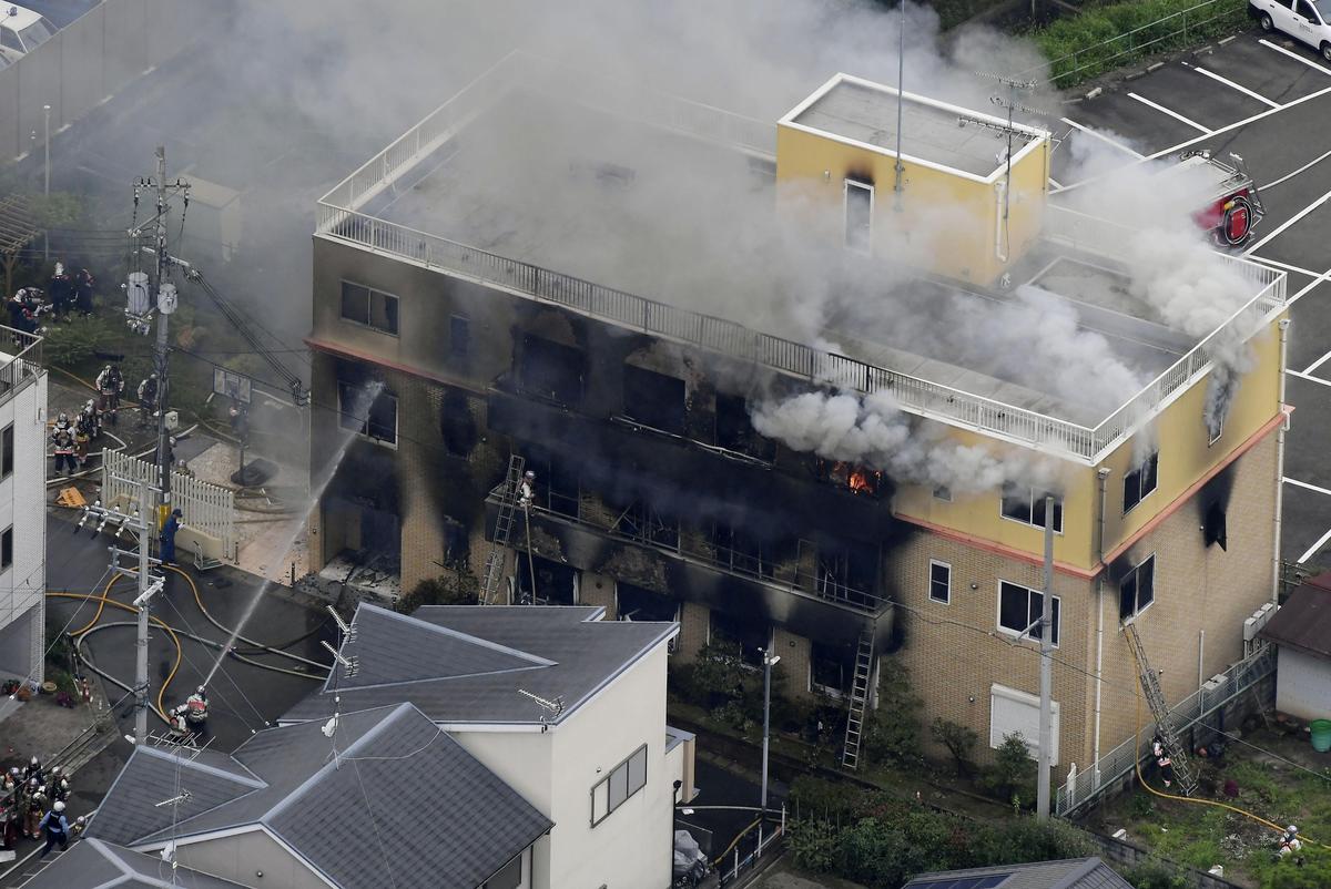 Smoke billows from a three-story building of Kyoto Animation in a fire in Kyoto, western Japan, July 18, 2019.