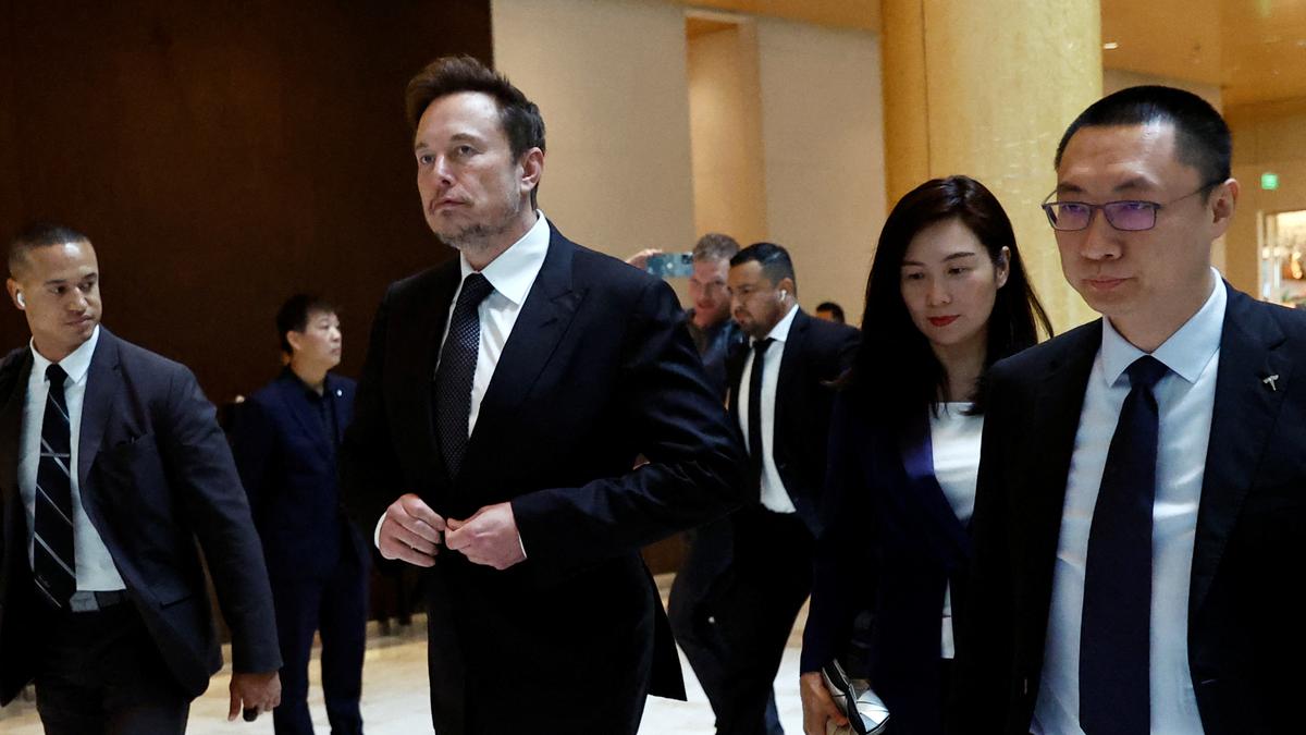 China's Industry Minister Jin Zhuanglong, Tesla's Elon Musk meet, discuss electric cars