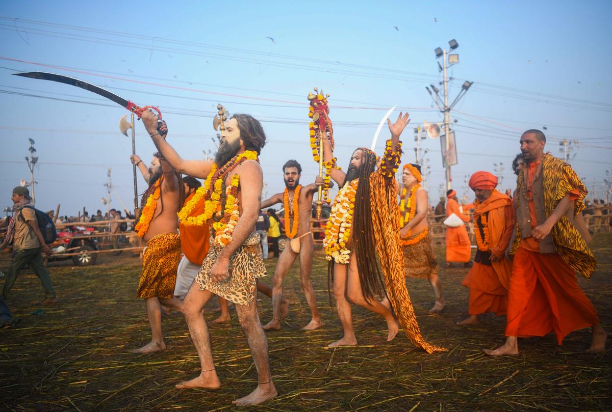 Naga Sadhus arrive to take a dip at Triveni Sangam at Mahakumbh in Prayagraj