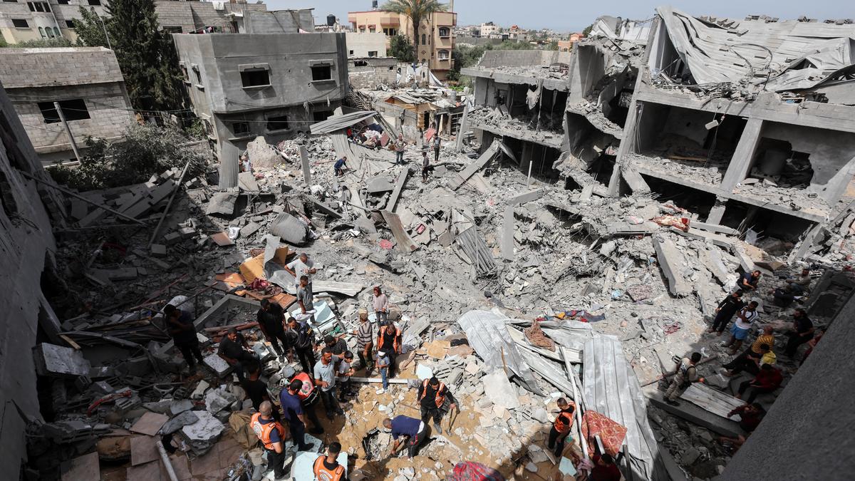 An airstrike kills 20 in central Gaza and fighting rages as Israel's leaders air wartime divisions