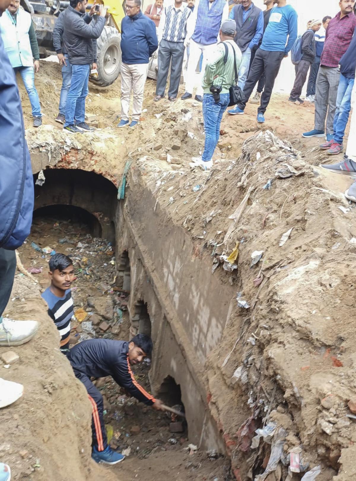 Workers during excavation work at a site at Chandausi area, in Sambhal district, Sunday, Dec. 22, 2024. 