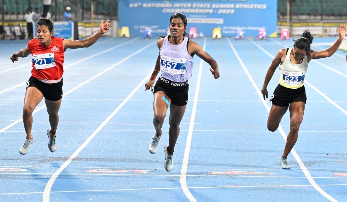 Dhanalakshmi, centre, wins the women’s 100m at the 64th National Inter-State senior athletics championships in Chennai on Wednesday, August 20, 2025.