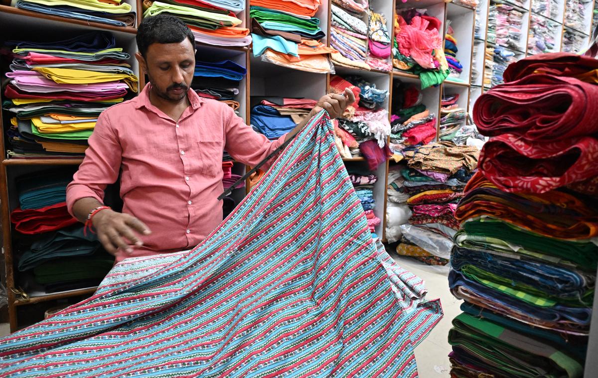 At Uppukinar Lane, customers choose from fabrics and tailored sets at the many textile shops in the neighbourhood.