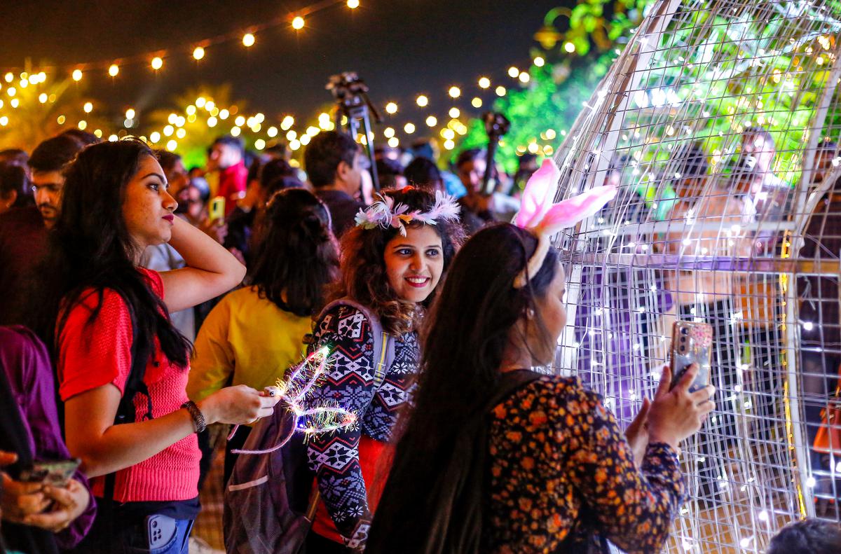 People enjoy their New Year’s Eve at Bandra on Saturday. 